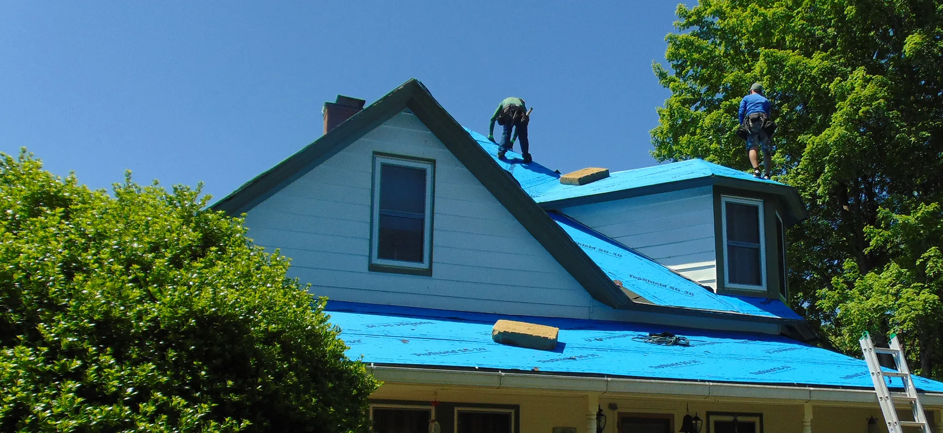 White home with a newly installed roof.