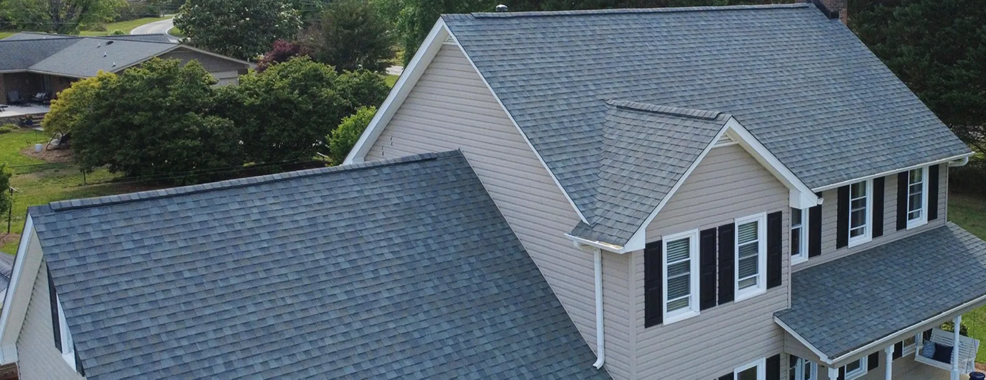 White home with a shingle roof.