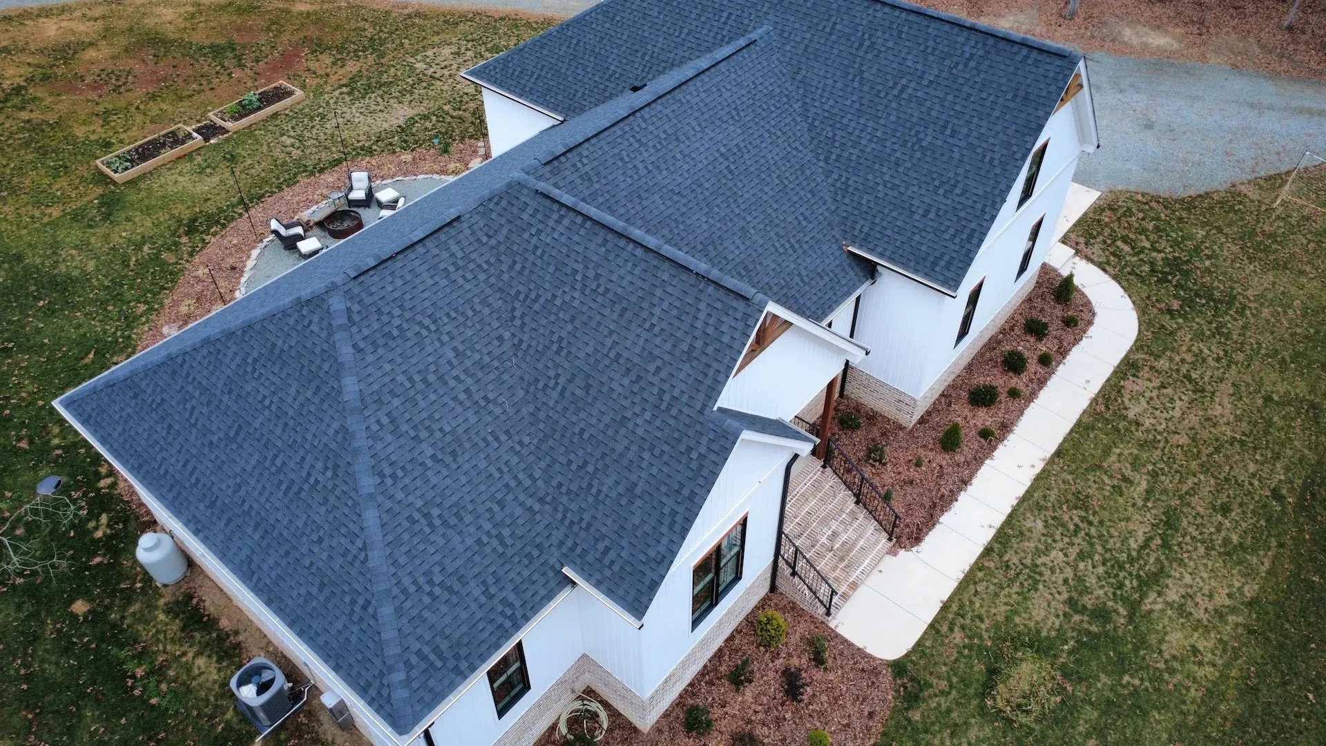 Aerial view of a new residential shingle roof.