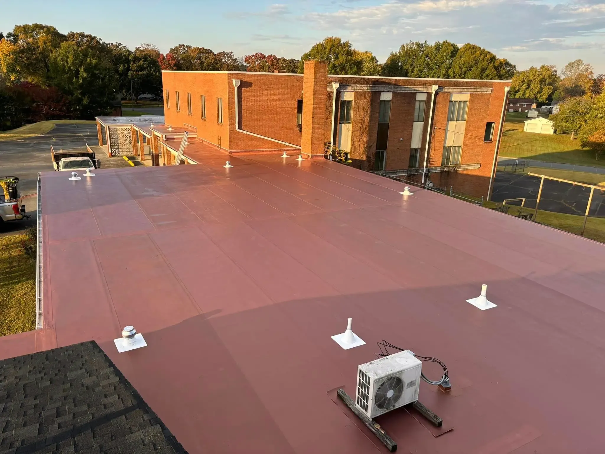 Commercial roofing repair with membrane coating.
